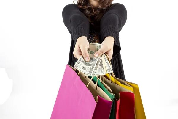 Woman with a lot of shopping bags and dollars — Stock Photo, Image