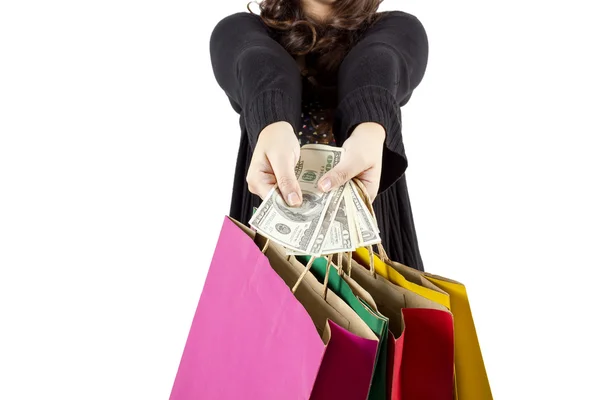 Woman with a lot of shopping bags and dollars — Stock Photo, Image