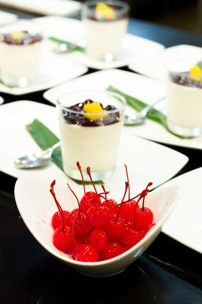 Cherry maraschino in white cup with smoothie yogurt background — Stock Photo, Image