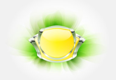 Yumuşak yeşil zemin üzerinde kristal olan sarı metalik rozet.