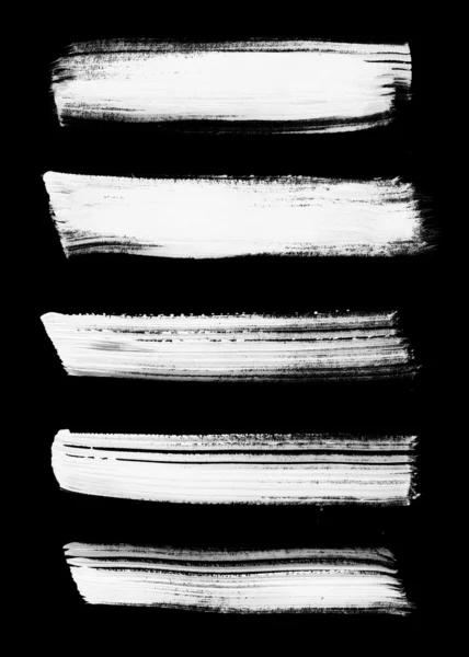 Beyaz soyut el fırça darbeleri koleksiyonunda siyah boyalı — Stok fotoğraf
