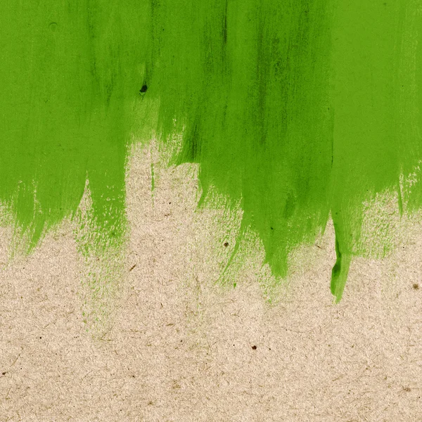 Green hand-painted brush stroke daub background over old vintage paper — Stock Photo, Image