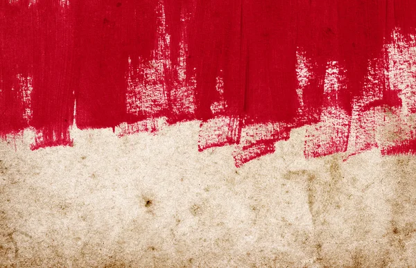 Red hand-painted brush stroke daub background over old vintage paper — Stock Photo, Image