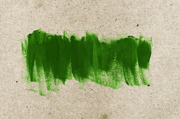 Green hand-painted brush stroke daub background over old vintage paper — Stock Photo, Image