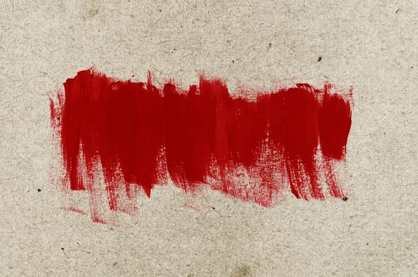 Red hand-painted brush stroke daub over old vintage paper — Stock Photo, Image