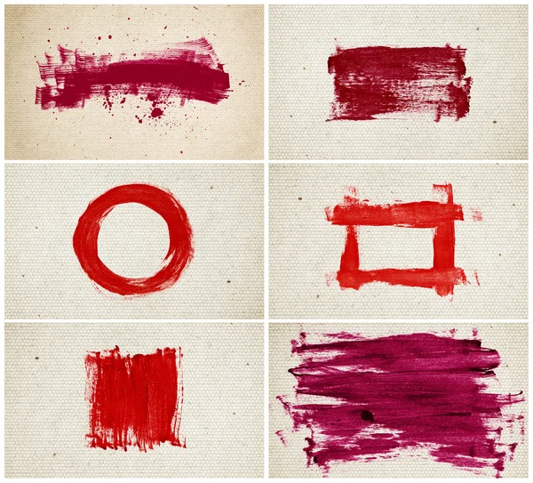 Ein Satz roter handbemalter roter Kleckse und Pinselstriche über altes Altpapier - Leinwand — Stockfoto