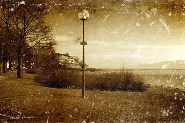 Distressed vintage grungy photo of lantern on a street — Stock Photo, Image