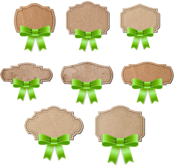 Vintage cardboard old paper retro style labels decorated with green silky bows