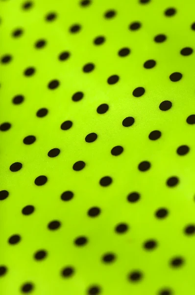 Bright green dotted vinyl texture background closeup — Stock Photo, Image