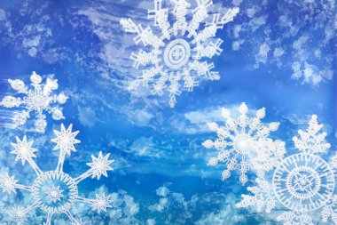 Wintery Holiday Snowflakes Against a Blue Background clipart