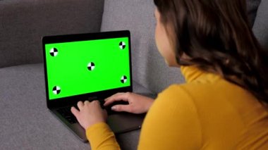 Green screen laptop woman distance works for computer typing text on keyboard