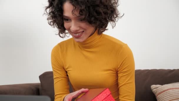 Close up happy woman in party hat opens red gift box and surprised, birthday — Video