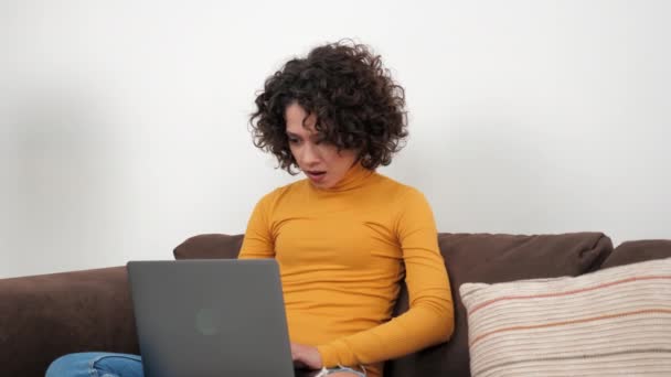 Excited curly woman student winner celebrating admission to university, laptop — Stockvideo