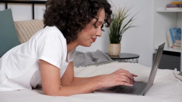 Smiling Hispanic Curly Woman Student Study Uses Laptop Typing Keyboard — Video