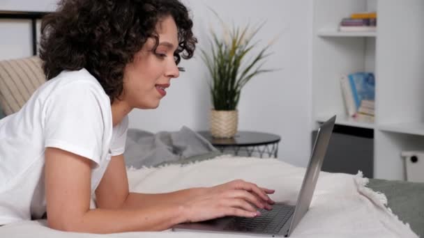 Smiling Hispanic Curly Woman Student Study Uses Laptop Typing Keyboard — Stock video