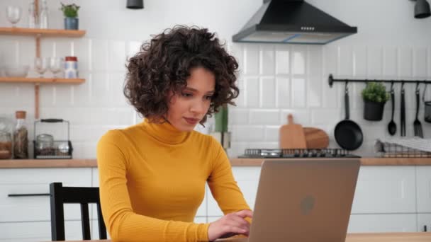Excited Curly Woman Student Uses Laptop Celebrating Admission University Home — Vídeos de Stock