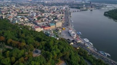 Aerial view beautiful Kyiv cityscape river station, postal and contract area on a sunny spring day. Drone shot Kiev building. Capital of Ukraine 
