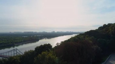 Drone aerial view Kyiv cityscape on a beautiful sunrise, dnipro river. Capital of Ukraine