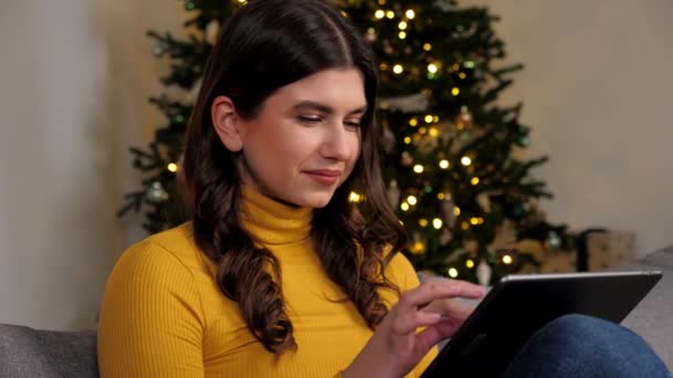 Close Smiling Woman Buys New Year Gifts Internet Using Tablet — Vídeos de Stock