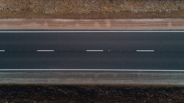 Close up drone aerial top view new asphalt road in summer on a sunny day