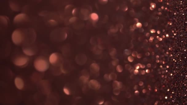 Copper Glitter Background. Brown light bokeh, magic christmas lights, shiny texture, holiday lights, flying particles form a beautiful bokeh. Shining festive Christmas backdrop. Vertical Video — Stock Video