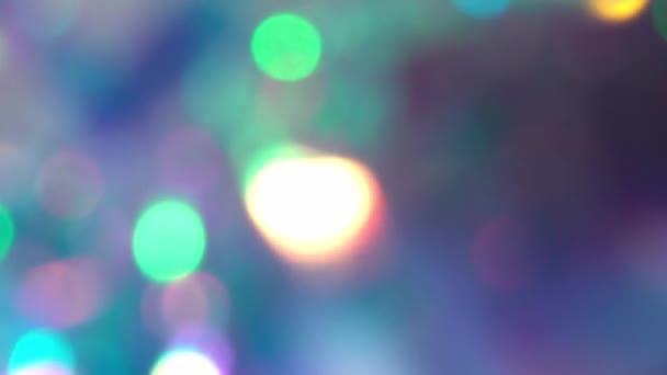 Christmas tree lights, happy New year. Holiday background of abstract glitter bokeh with multiple colors. Blue pink purple neon pastel gradient of diamonds — Stock Video