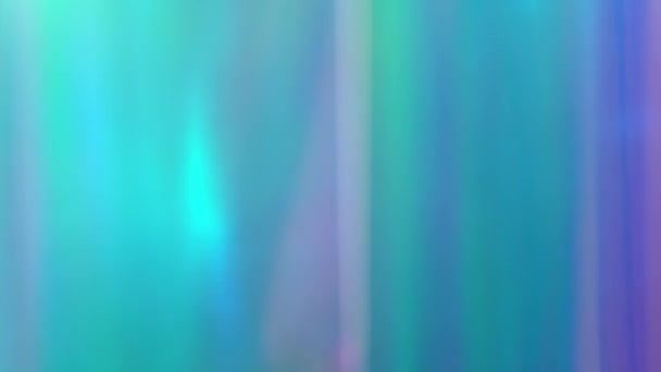 Holograficzne rozmycie ostrości Abstrakcyjne wielokolorowe rozmyte tło jednorożca, tęczowe różowe niebieskie tężec i fioletowe światło przecieka kolory pryzmatu, rozmyty blask. Miękkie pastelowe ruchome tło na wakacje. — Wideo stockowe