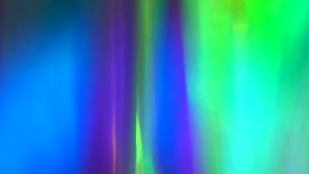 Groen blauw roze teal kleuren abstracte feestelijke achtergrond. Optische lichtbreking door een prisma, bokeh glow glow flare. Achtergrond voor Kerstmis, Gelukkig Nieuwjaar, Vakantie en Feest — Stockvideo