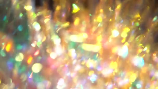 Shinny festive New Years golden tinsel. Christmas night. Lights glare bokeh — Stockvideo