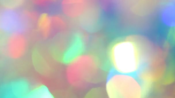 Pastel neon colors defocused lights bokeh. Sparkling highlights and rainbow colors. Abstract holographic background — Vídeo de Stock