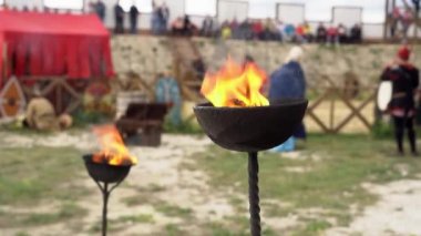Gladiator Show in Ancient Rome. Burning torch. A Roman gladiator was an ancient professional fighter. Antique torches with a burning flame