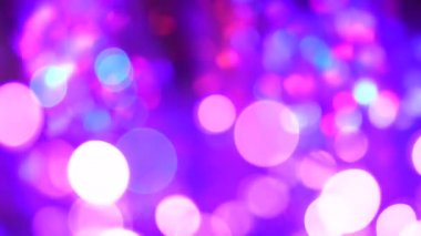 Mor pembe çok dutlu ve mavi tek boynuzlu at bokeh ışıkları. Neon renkli daireler, soyut arkaplan