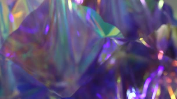 Defocused purple very peri pink blue color light through crystal. Festive neon abstract holographic retro background for party — Stock Video