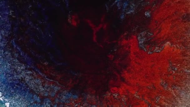 Blue purple and red ink splash. Chemical reaction macro, micro explosion. Decorative liquid abstract background. The Universe Cosmic Eye of God Nebula. Rotation in a circle — Stock Video