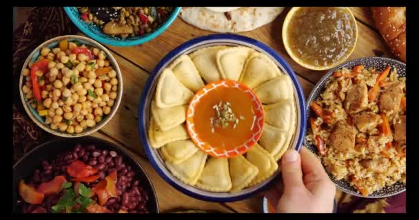 A samosa is a fried or baked pastry with a savory filling. Samosas are a popular entre, appetizer, or snack in the local cuisines of South Asia, the Middle East, Central Asia, East Africa. Ramadan — Stock Video