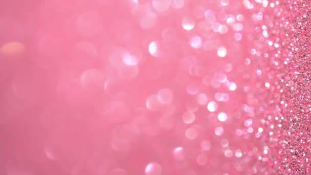 Rosa glitter glänsande textur. Magiska semester ljus vertikal bakgrund, flygande partiklar bildar en vacker bokeh. Glänsande festlig jul bakgrund — Stockvideo