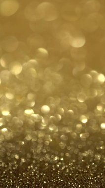 Parlak altın yüzey dönüyor. Sihirli bokeh arkaplanı