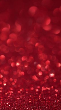 Parlak kırmızı yüzey dönüyor. Sihirli bokeh arkaplanı