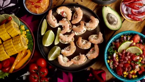 Traditional Mexican food top view. Shrimp appetizer, Pico de gallo, Nachos, Guacamole, Corn Tortilla chip, Salsa — Video Stock