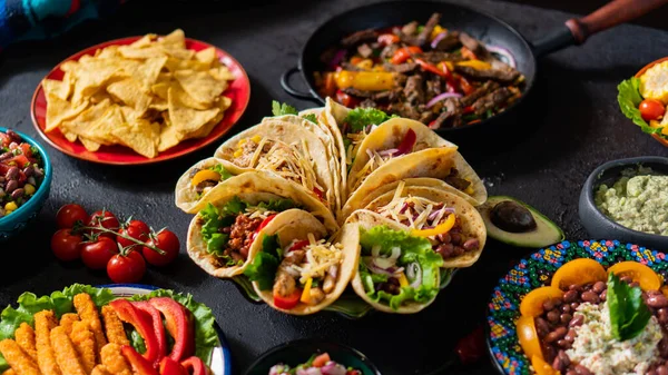 Mexican table Taco, Guacamole, Fajita, Salsa sauce, Corn Tortillas, Nachos, Burrito, Pico de gallo — Stock Photo, Image