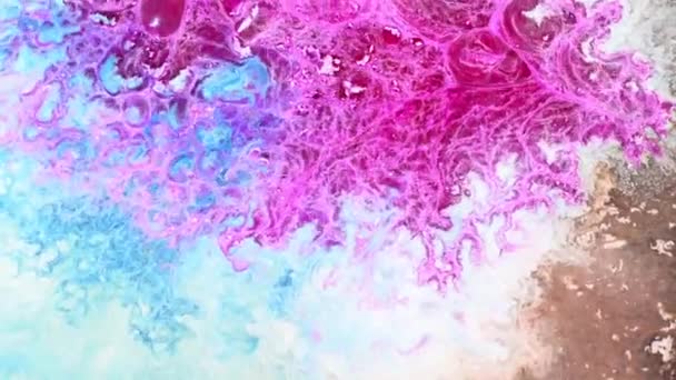 A splash of liquid magenta teal blue and white colors. Magical vivid ink chemicals reaction macro. Abstract art background — Vídeo de Stock