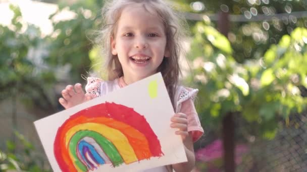 Happy Little Girl Holding Childrens Rainbow Drawing — Stock Video
