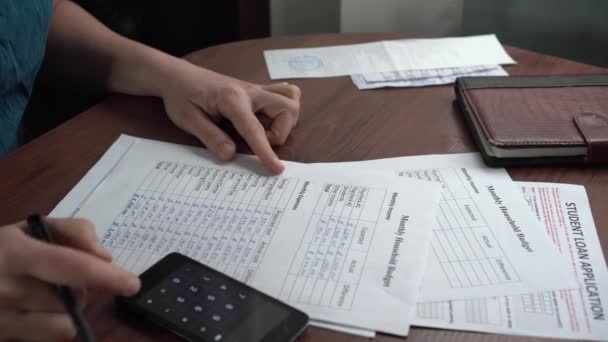 Global financial crisis. Worried jobless woman calculating their domestic budget at home. Family budgeting, expenses and income, utilities, debts, loans, bills, mortgages