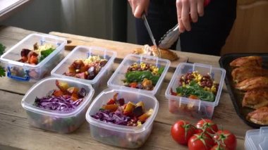 Meal prep. Homemade takeaway food in plastic containers. Woman cooks healthy office lunch portion at home. Keto diet. High quality FullHD footage