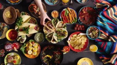 Mexican holiday. Family and friends have dinner together at the table. Traditional Mexican cuisine.