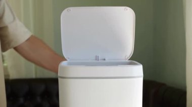 The American dollar is thrown into the trash. Financial crisis, inflation. Contactless Smart Touch Trash Can. High quality 4k footage