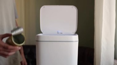 Metal tin can for recycling, food packaging waste. Recyclable materials paper plastic glass metal. Contactless Smart Touch Trash Can. High quality 4k footage