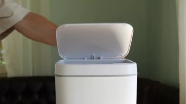 Crumpled office paper thrown in the trash. Office documents waste, paper recycle. Contactless Smart Touch Trash Can. High quality 4k footage