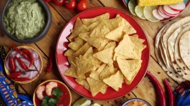 Tortilla chips nachos and guacamole avocado sauce. Traditional mexican appetizer, tex mex food. High quality 4k footage
