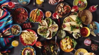 Mexican family celebrates Cinco de mayo together at a festive table. Mexican food. High quality 4k footage